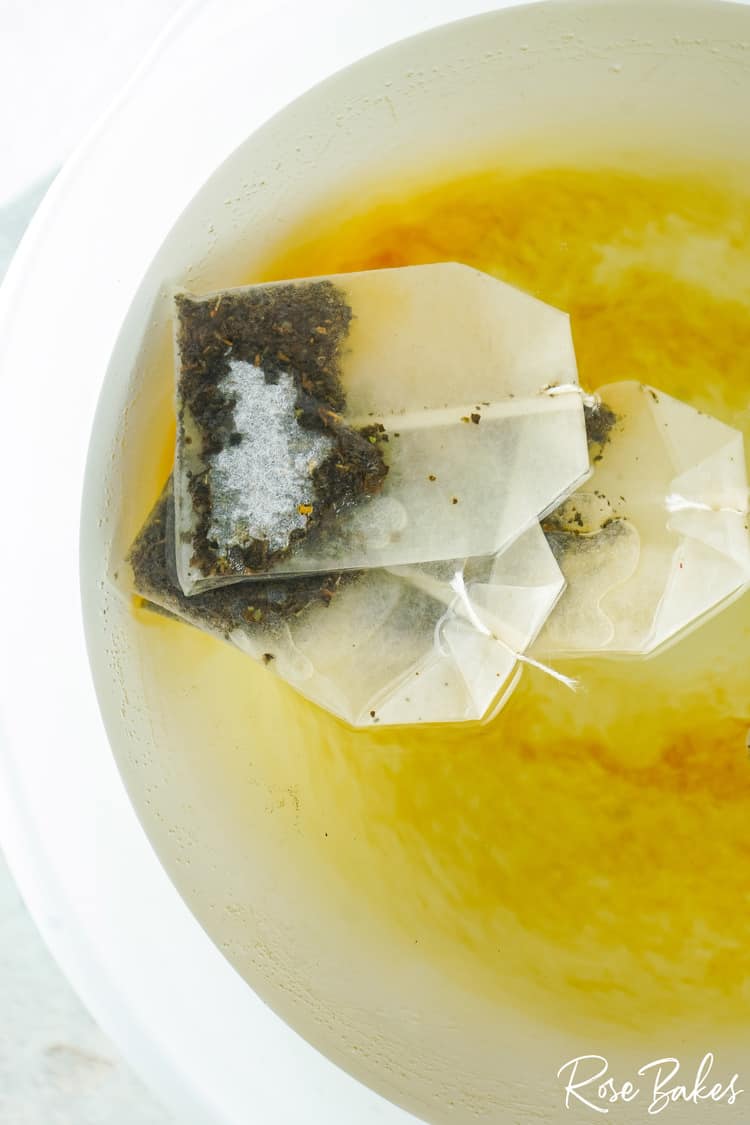 black tea bags added to boiling water 