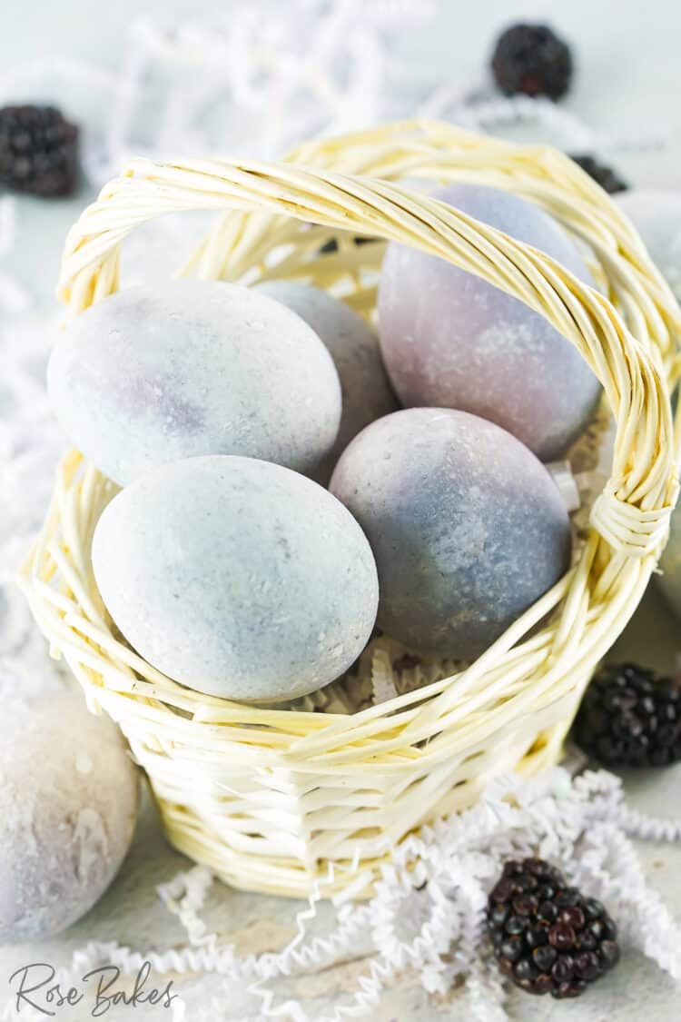 Dyed eggs in a wooden easter basket 