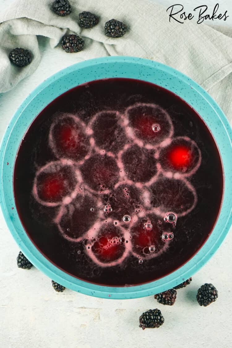 eggs sitting in black berry juice for coloring 