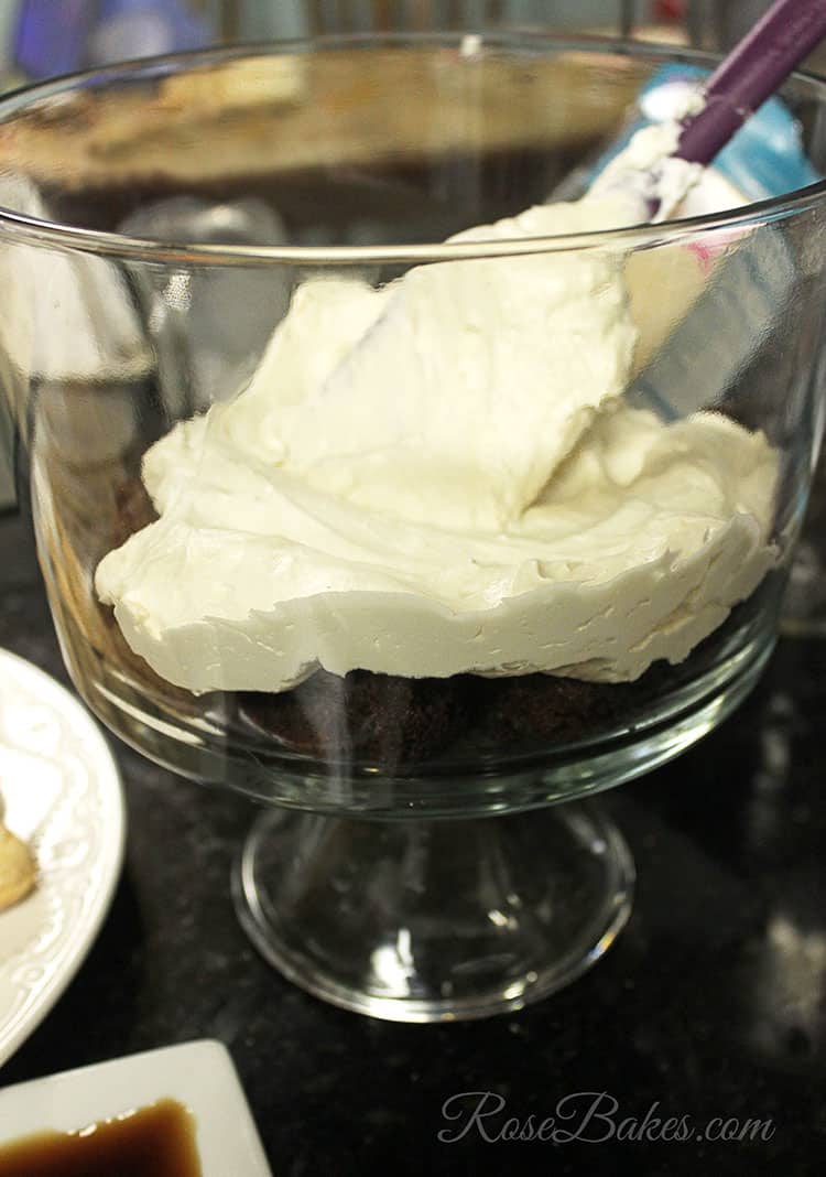 Brownie Trifle being layered into a clear dish