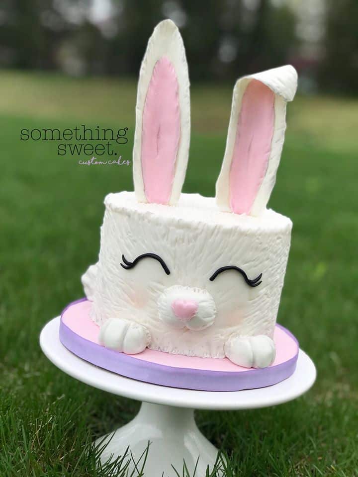 White Easter Bunny Cake on cake stand in grass
