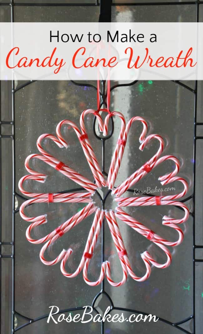 christmas candy cane wreath hanging on a glass door