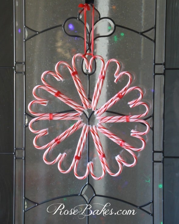 Completed candy cane wreath hanging on a door