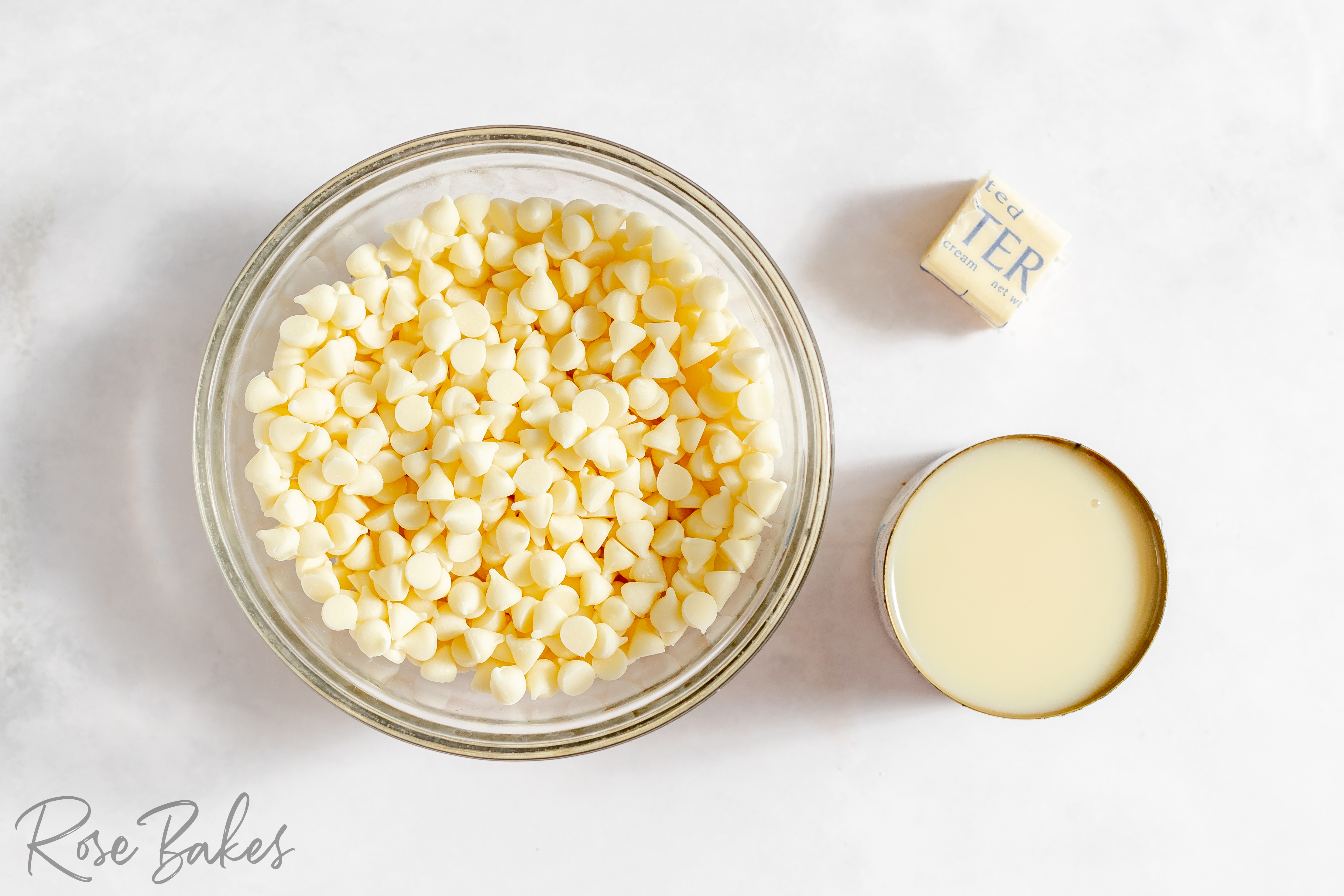 bowl of white chocolate chips, butter, and sweetened condensed milk