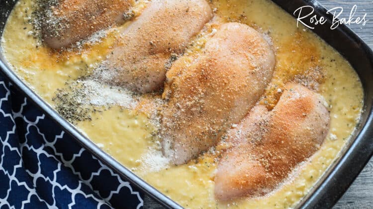 seasonings spread on chicken breasts in rice mix