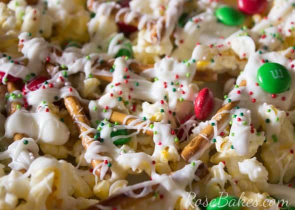 Christmas Popcorn Snack Mix with sprinkles, m&ms, pretzels, and white chocolate