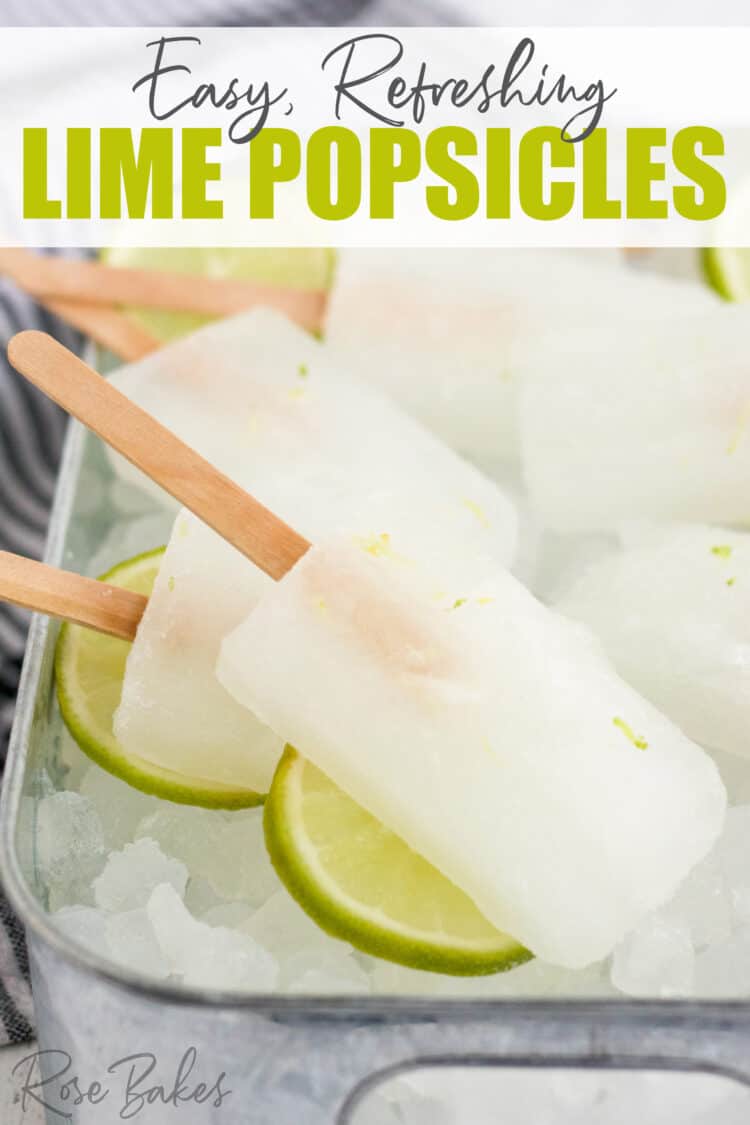 Popsicles with wooden popsicle sticks laying in a dish of crushed ice and slices of lime. The text at the top of the image reads, Easy, refreshing, lime popsicles.