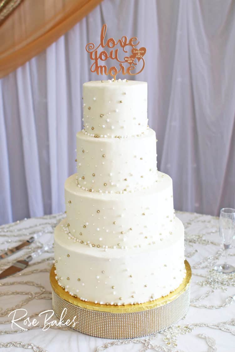 White Wedding Cake with Gold and White Pearls