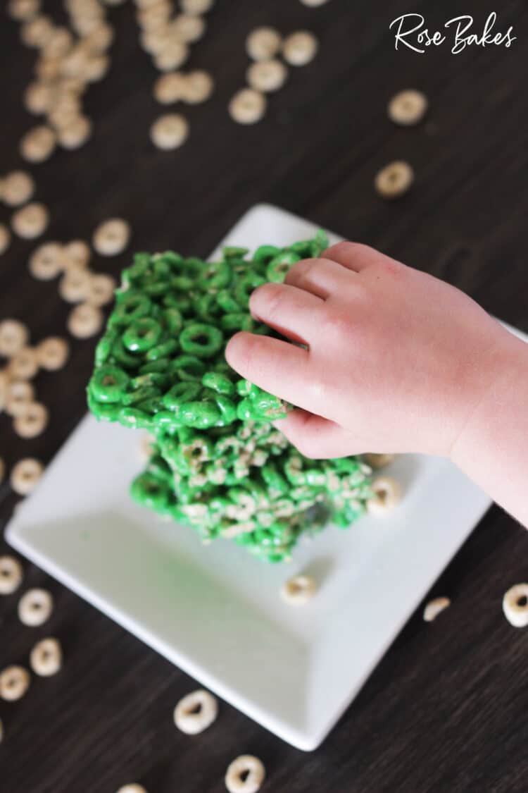 small hand getting Cheerios Cereal Bars for St. Patrick's Day