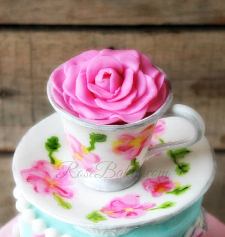 Gum paste tea cup cake topper with fondant rose and hand-painting