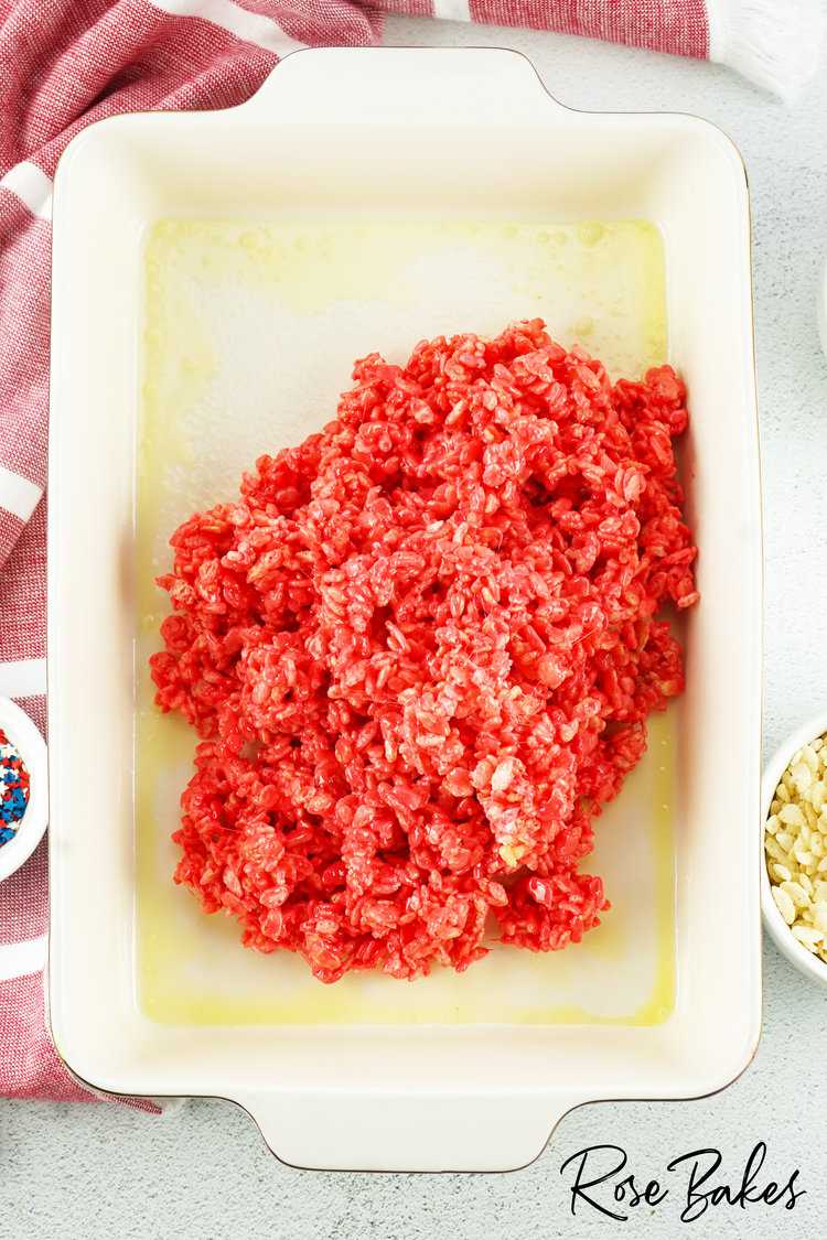 red rice krispies in a baking dish sprayed iwth butter spray