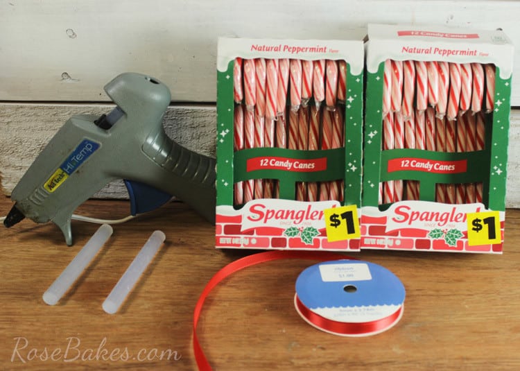 Supplies to make a candy cane wreath - 2 boxes of candy canes, ribbon, glue gun