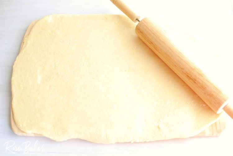 Raspberry Cinnamon Rolls dough rolled out on cutting board