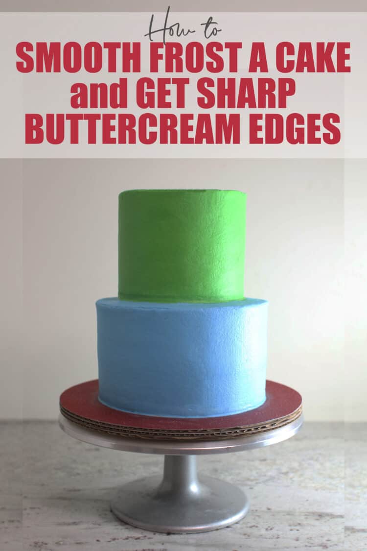 2 tier green and blue buttercream cake with smooth sides and sharp edges on silver cake stand 