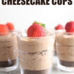 Creamy No-Bake Chocolate Cheesecake Cup in small clearglass with cookie crust and topped with strawberry