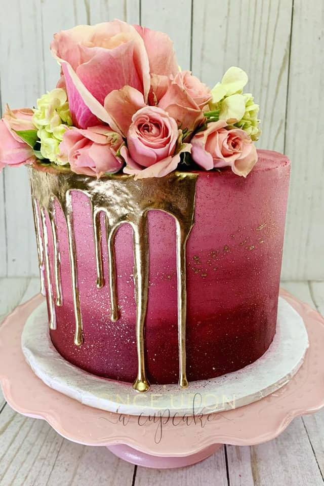 ombre pink cake with gold drip and fresh flowers