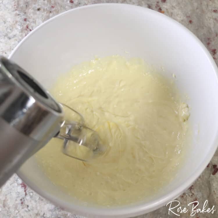 ingredients being combined using a hand held mixer 