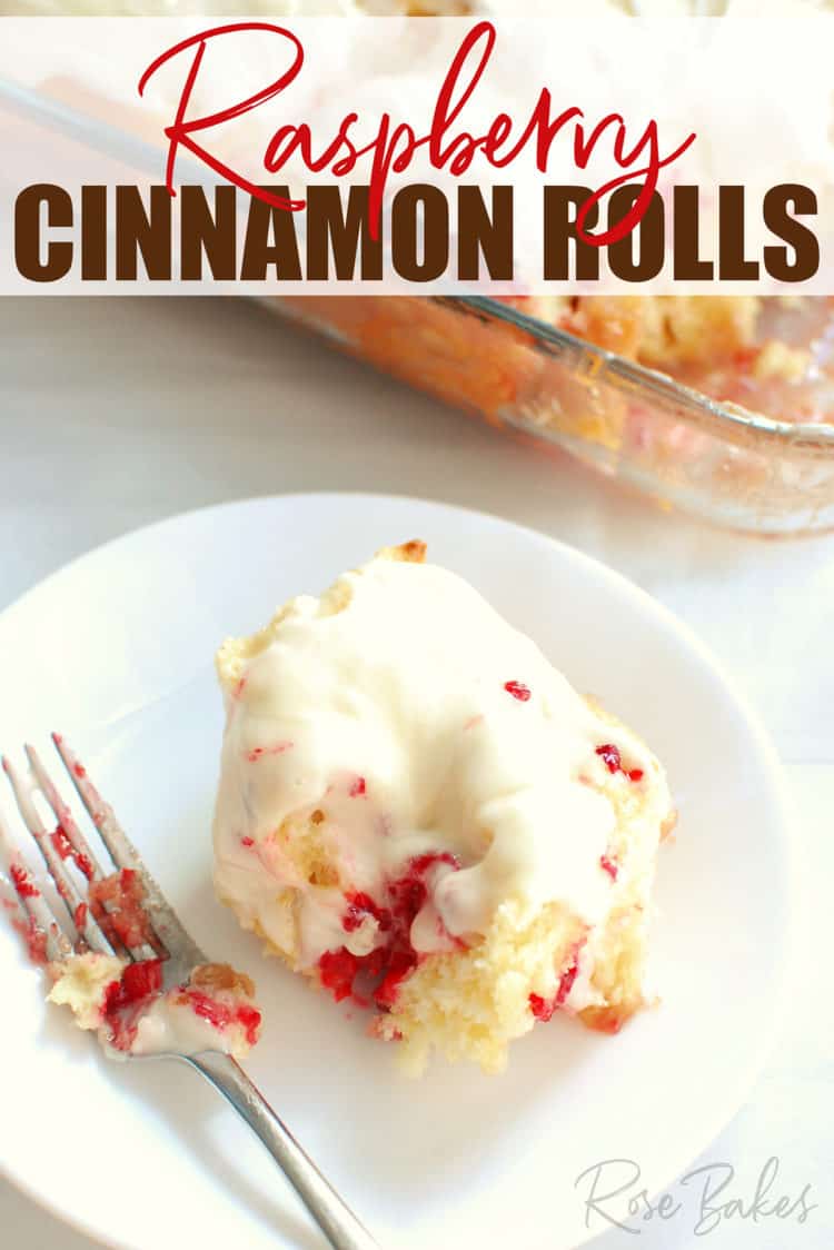 Raspberry Cinnamon Rolls on white plate with fork