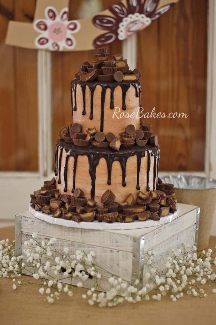 2 tier milk chocolate icing grooms cake with dark chocolate drizzle and peanut butter cups 