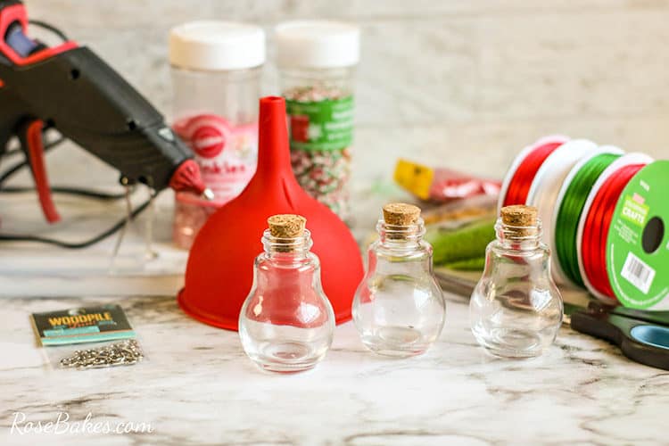 supplies for DIY Sprinkles ornaments on a table