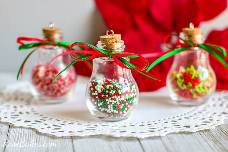 DIY Sprinkles Ornaments on a white doily with ribbons