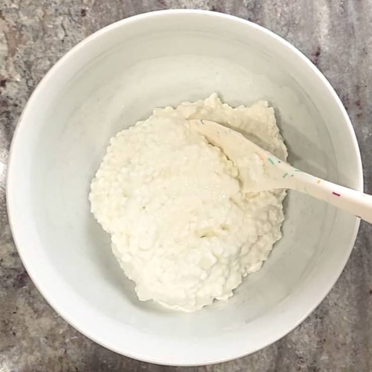 cottage cheese in a white mixing bowl