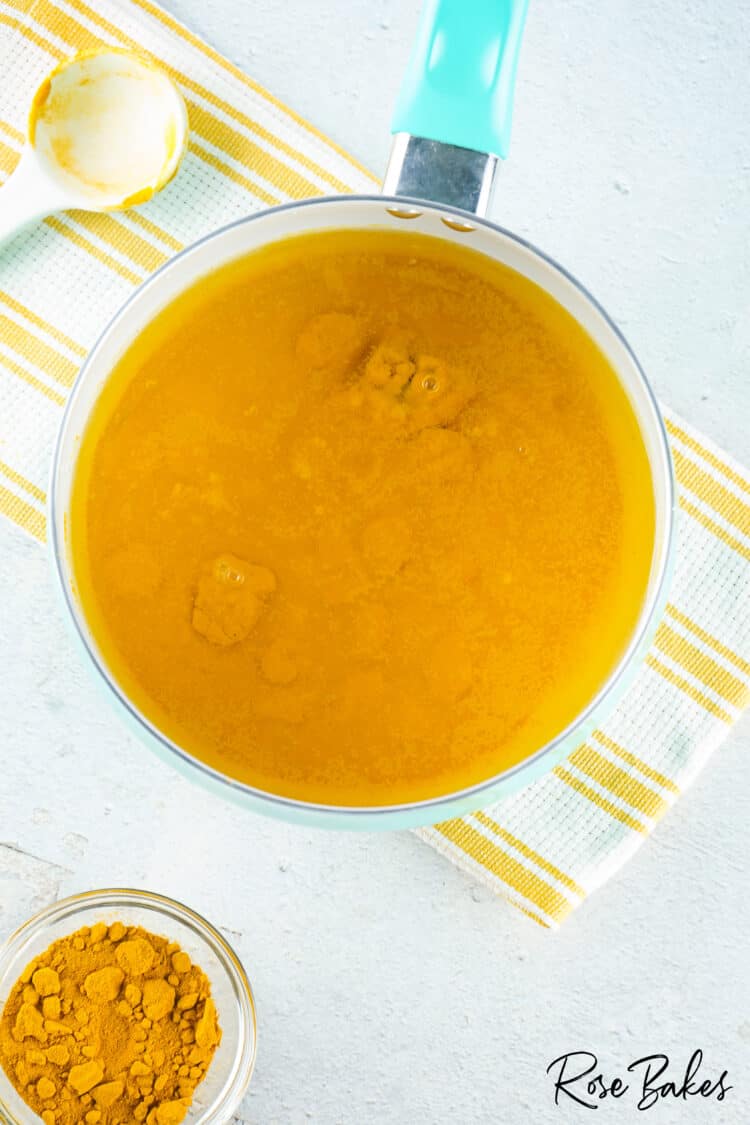 turmeric being added to water 