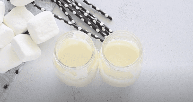 melted white candy in clear jars